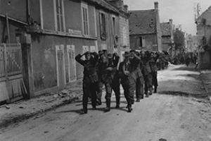 Browse German prisoners being marched back through the streets of St-Aubin