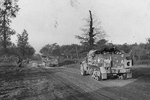 Browse Tanks and infantry cross the River Orne