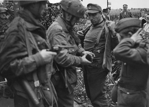 Captured German troops being searched