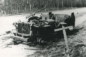 Browse Burnt out Jeep on side of road.