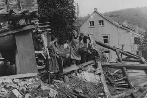 German women search the wreckage of their homes