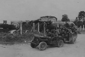 Browse Glider pilots in a trailer being pulled by a jeep