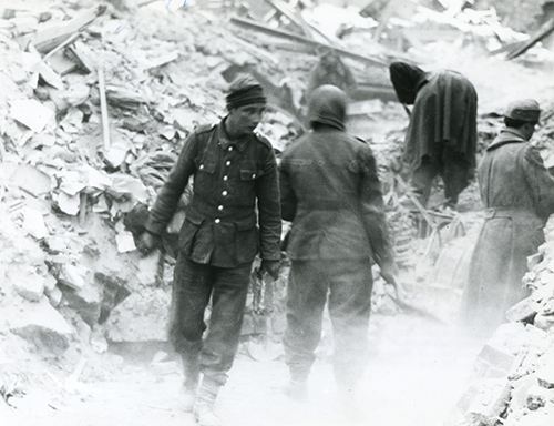 German prisoners help men of the 3rd Tank Battalion