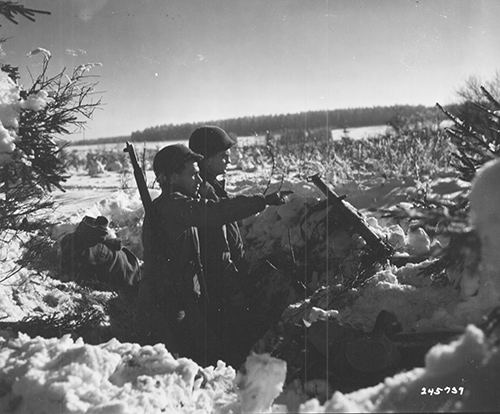 Two soldiers from the 36th Armored Infantry Regiment