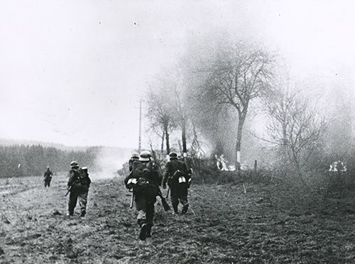 German soldiers advance during Ardennes offensive.