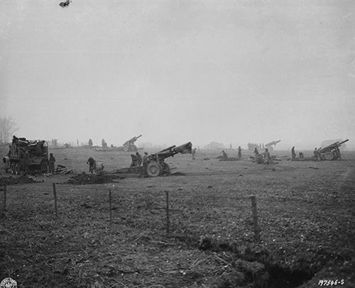 A field artillery unit digs in west of Bastogne