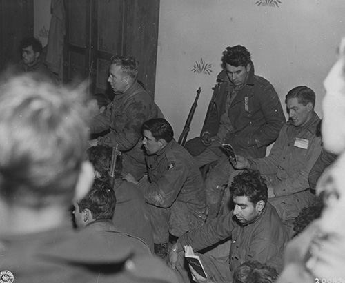 Christmas carols are sung by members of the 101st Airborne Division