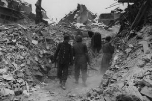 Browse German prisoners help men of the 3rd Tank Battalion