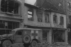 American ambulance waits outside a bombed building