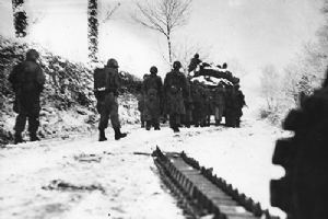 Browse US infantrymen follow a Sherman tank