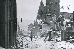 Browse A civilian picks his way through the rubble