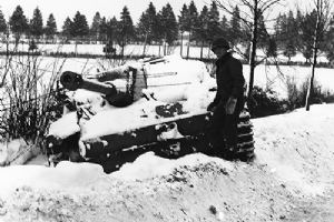 Browse US soldier inspects a knocked out Tiger tank