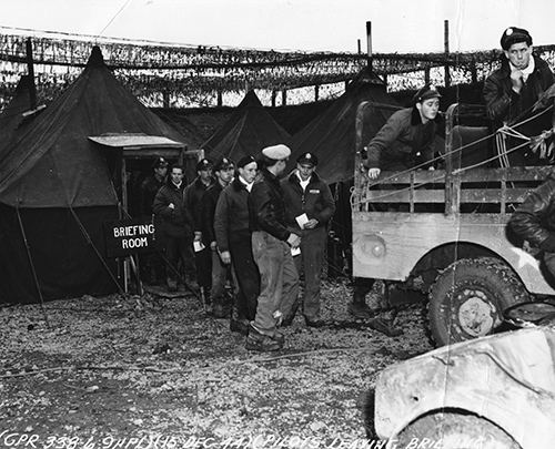 9th Tactical Airforce Pilot Officers leave a briefing