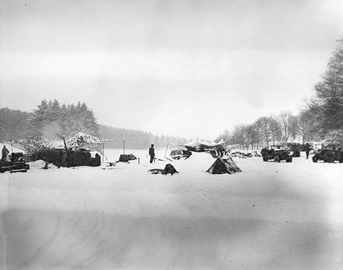 Camouflage netting hides 912th Field Artillery Battaliion