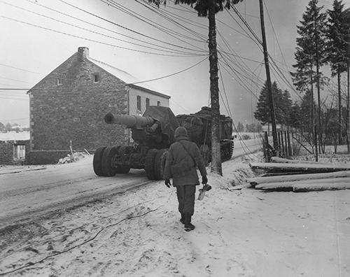 A prime mover tows a giant 8 inch howitzer