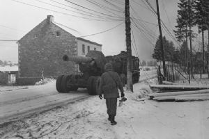 A prime mover tows a giant 8 inch howitzer