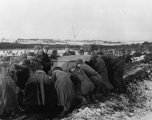 Germans trying to move a vehicle out of the Ardennes mud