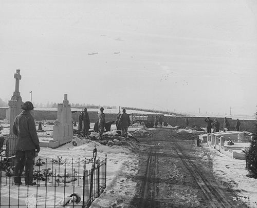 Members of 101st Airborne Division bury their dead