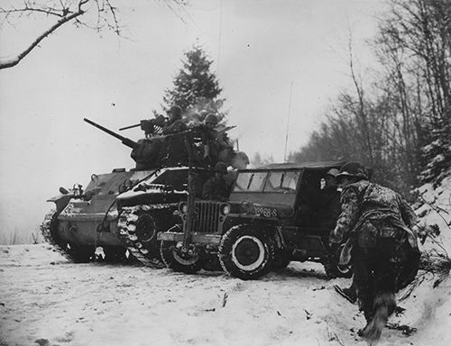 American troops recover a jeep previously abandoned