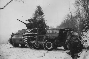 Browse American troops recover a jeep previously abandoned