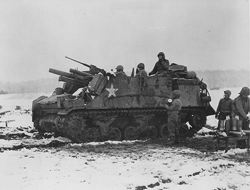 An American tank destroyer crew prepares to fire against enemy positions