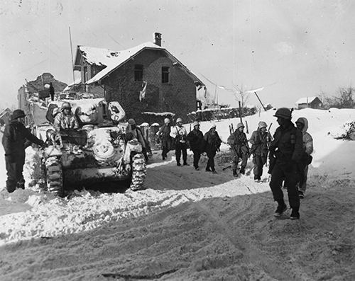 Infantrymen moving toward enemy positions in St Vith