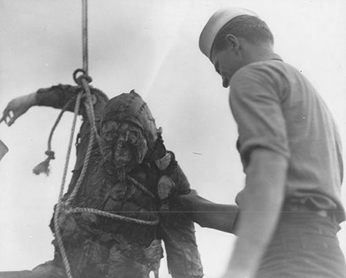 A service man retreieves a Japanese Airman