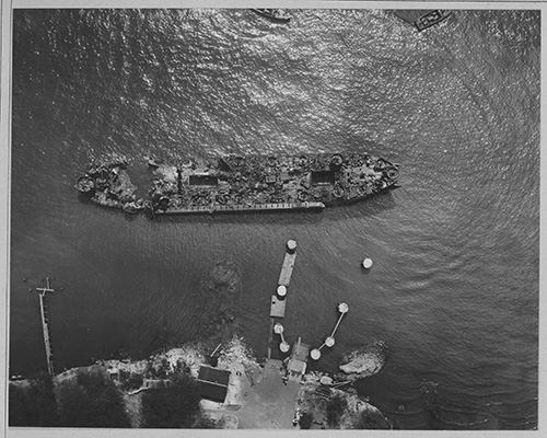 Overhead view of the burned out hulk of USS LST-480