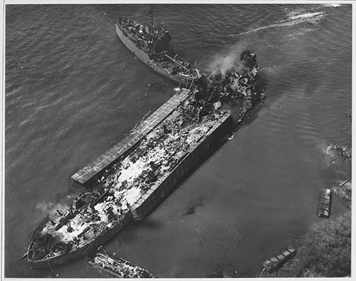 Overhead view of the burning hulk of USS LST-480